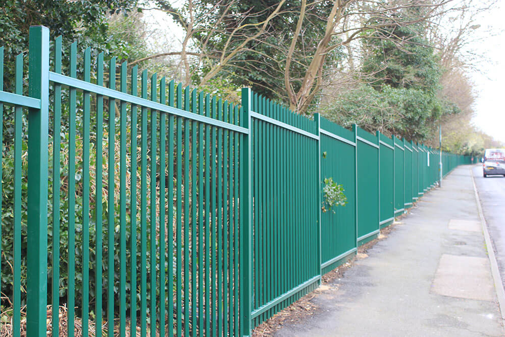 Green commercial vertical bar fencing