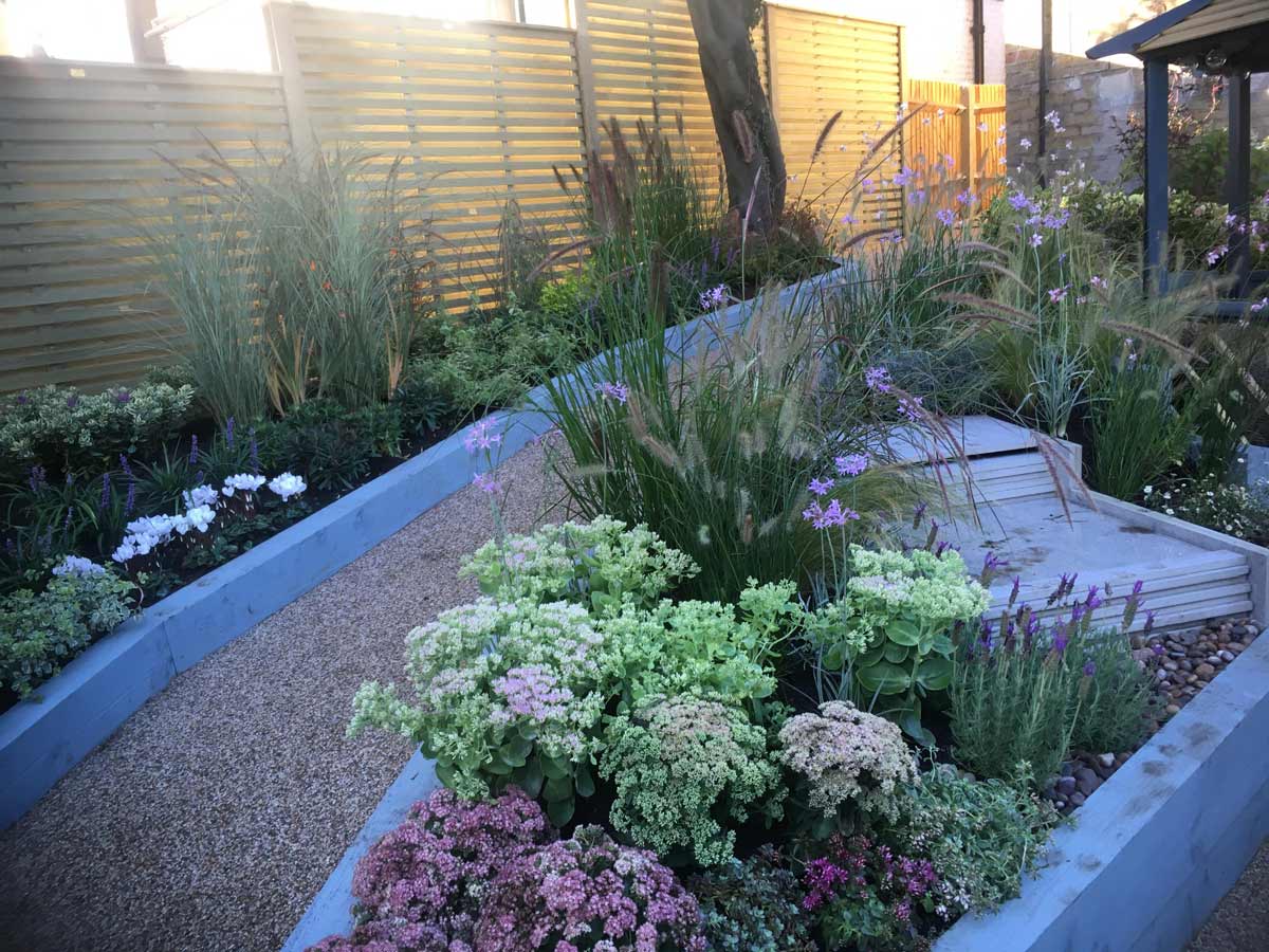 Sunny garden - venetian slatted fencing