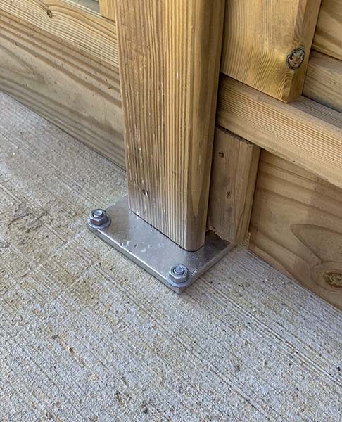 how to attach a fence to concrete
