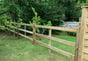 Post and rail morticed fencing in garden