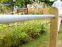 wooden post metal bar fencing