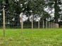 wooden fence stakes with wire