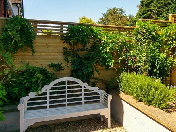 Contemporary combination solid and slatted fencing