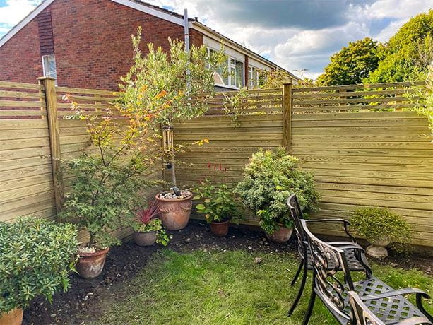 Horizontal slatted and solid fence panels