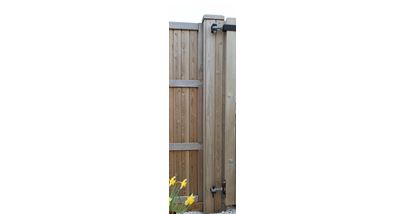 Courtyard gate post with timber cladding