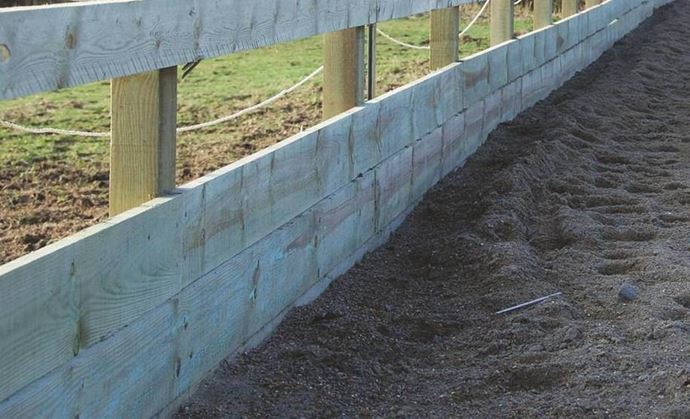Timber riding arena board