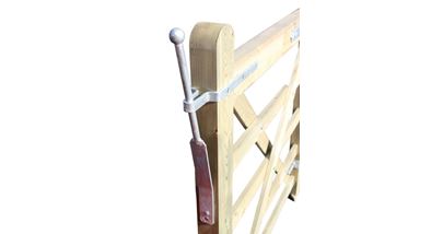 Gate spring catch lever on wooden entrance gate