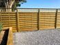 Hit and miss fence panels run