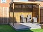 slatted wooden garden shelter