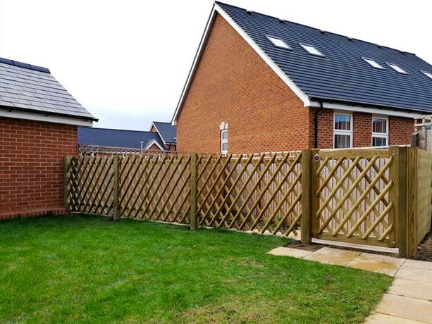criss cross wood fence with gate