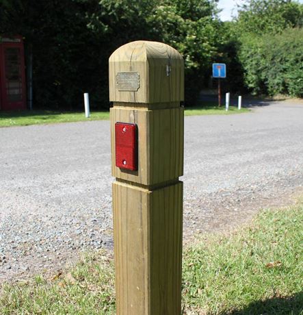 Verge marker protection post in grass