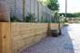Wooden sleepers raised beds