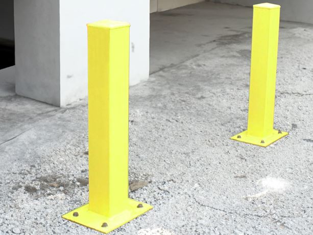 Metal bollards on concrete