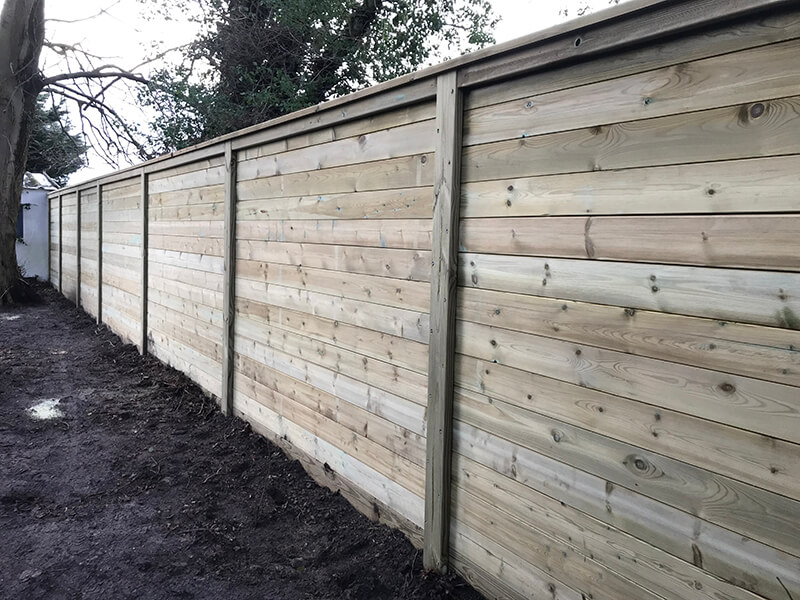 Acoustic Noise Barrier Fence Provides Sound Reduction From Busy Road Jacksons Fencing