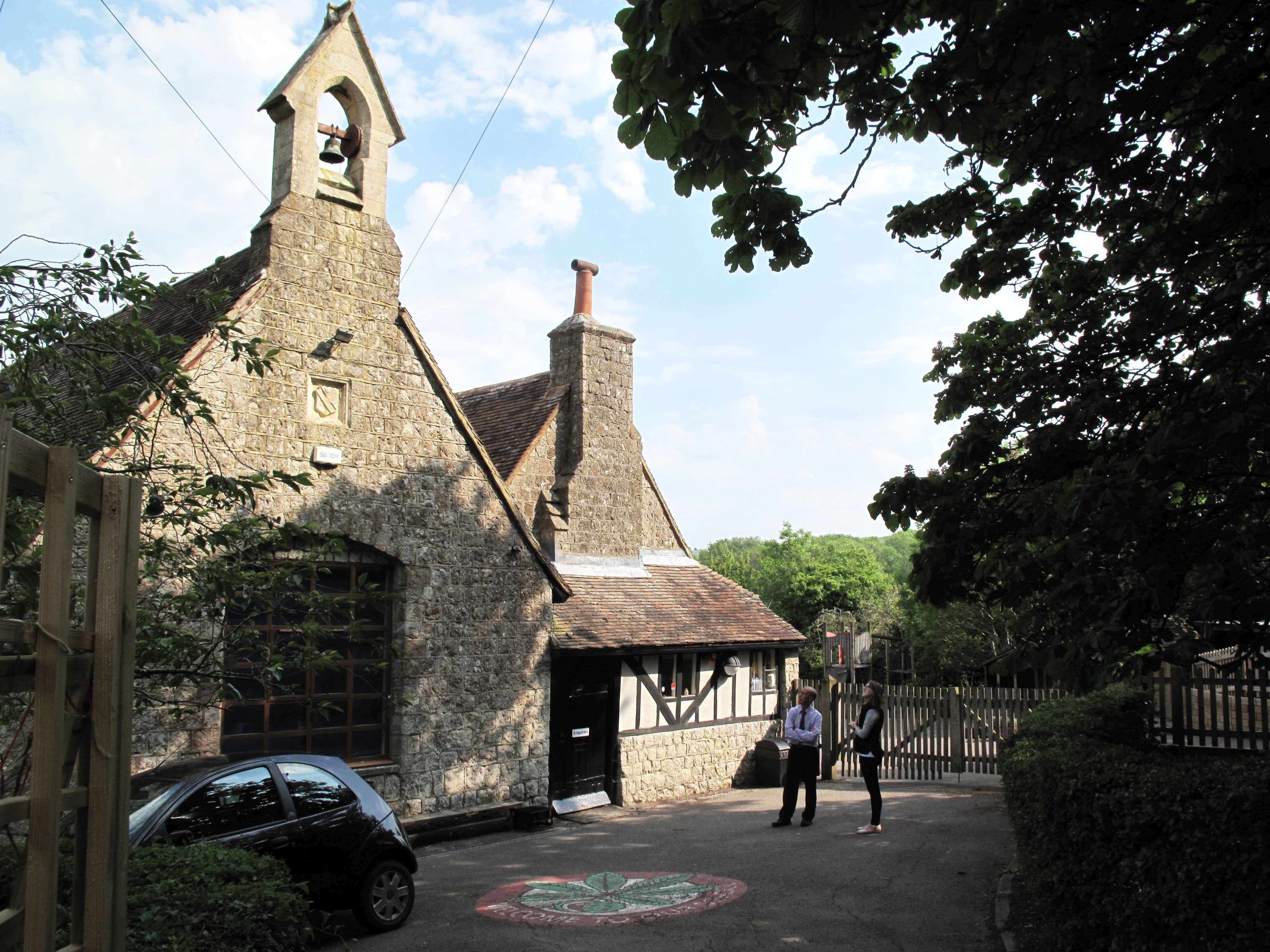 admiring the old school building and bell