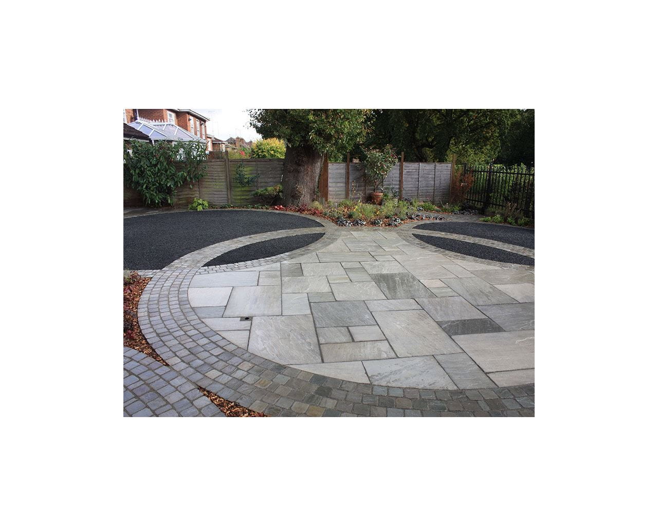 circular paving design with jacksons black railing