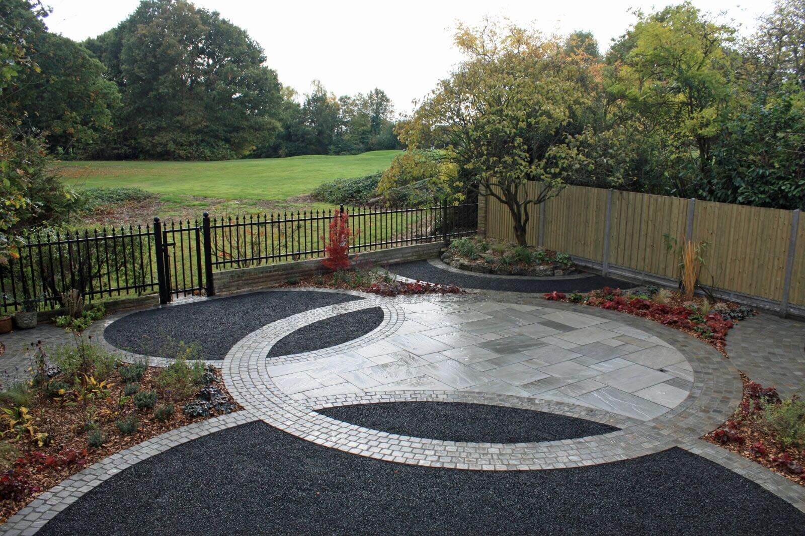 front garden view of basalt paving and fencing
