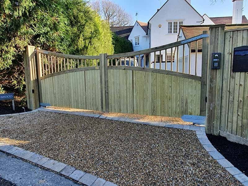 Custom wooden driveway gates bring ideal garden design to life