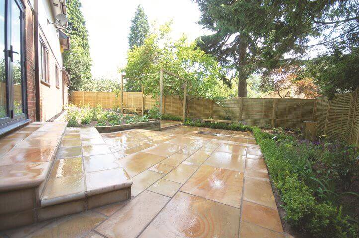 Long shot of garden and new venetian fence panels