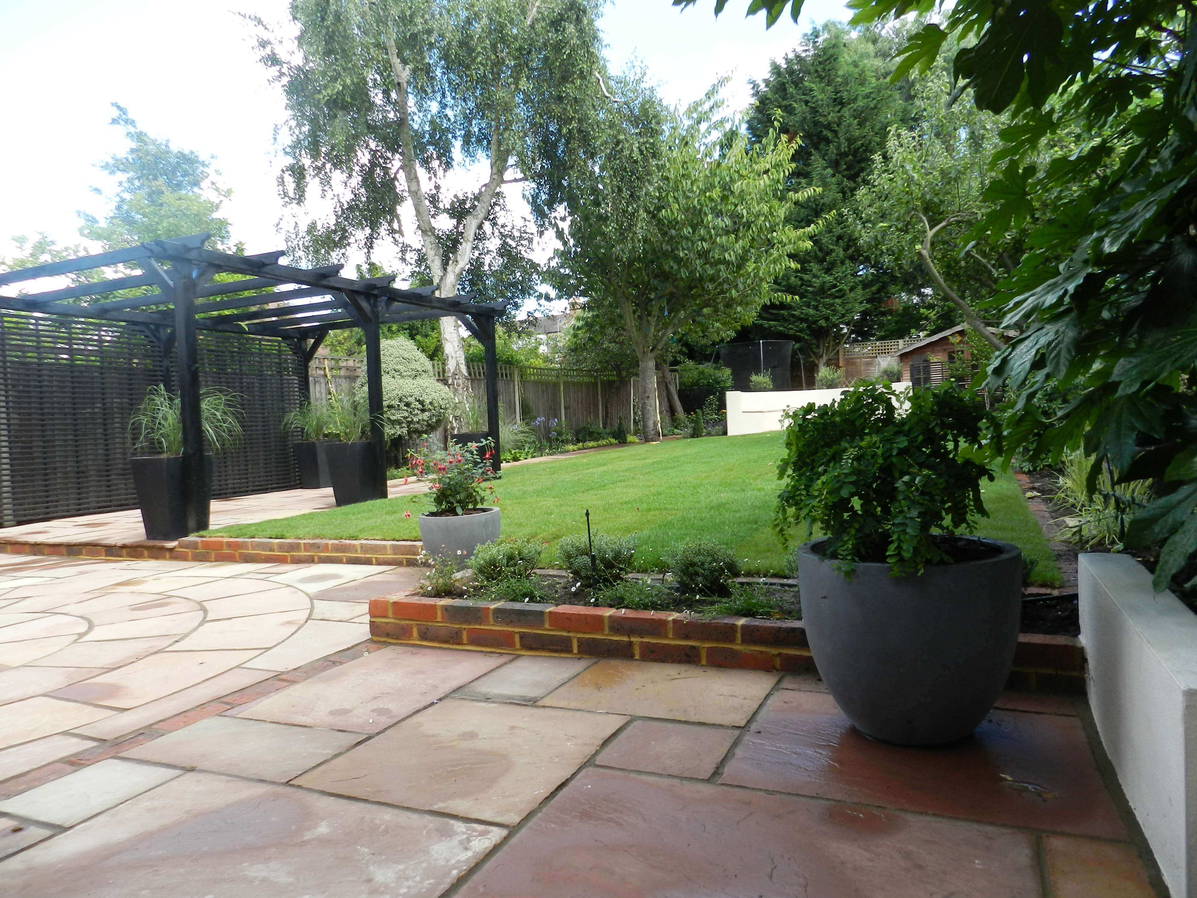 finished garden with timber pergola painted black