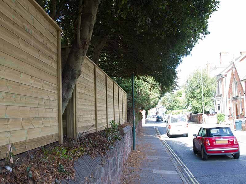 Acoustic fence next to road