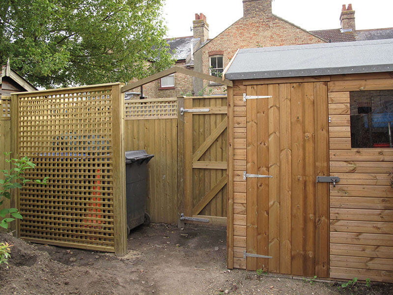 Lattice trellis panel hides bins