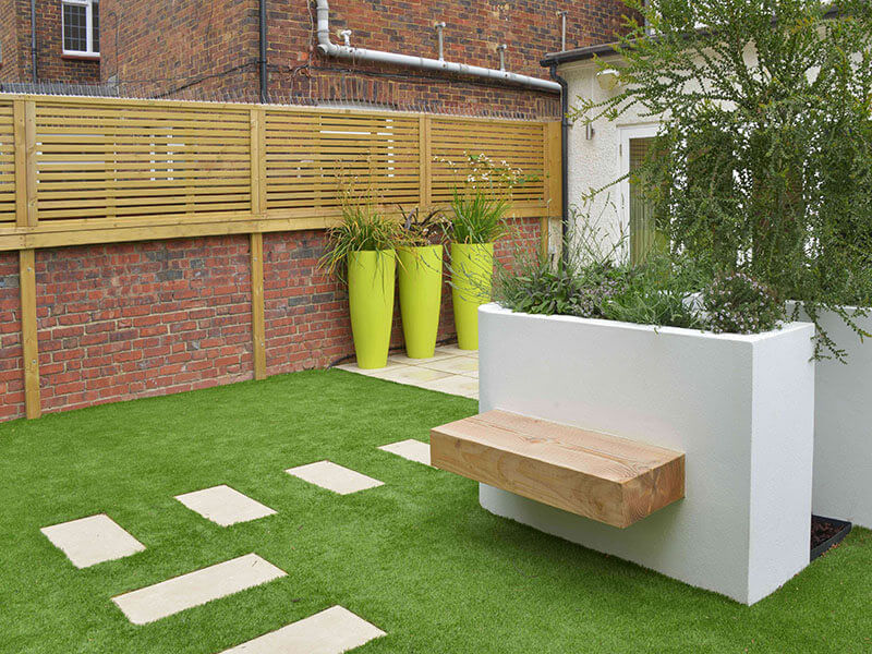 Venetian fence panels on wall with bench