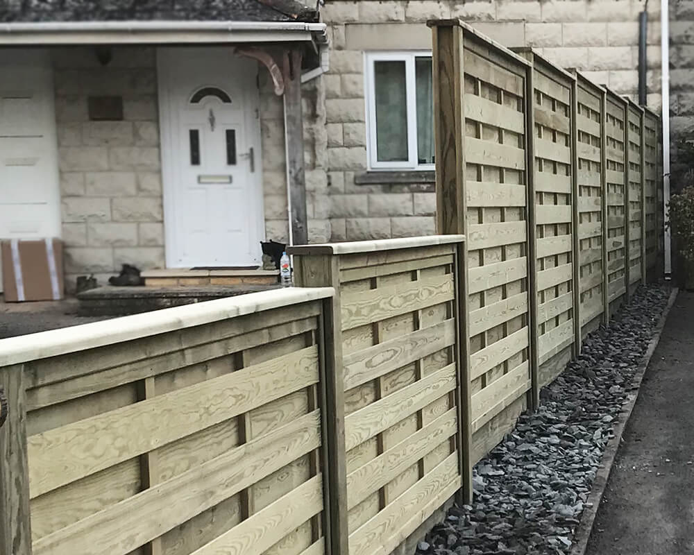 Installing stepped fencing on a driveway