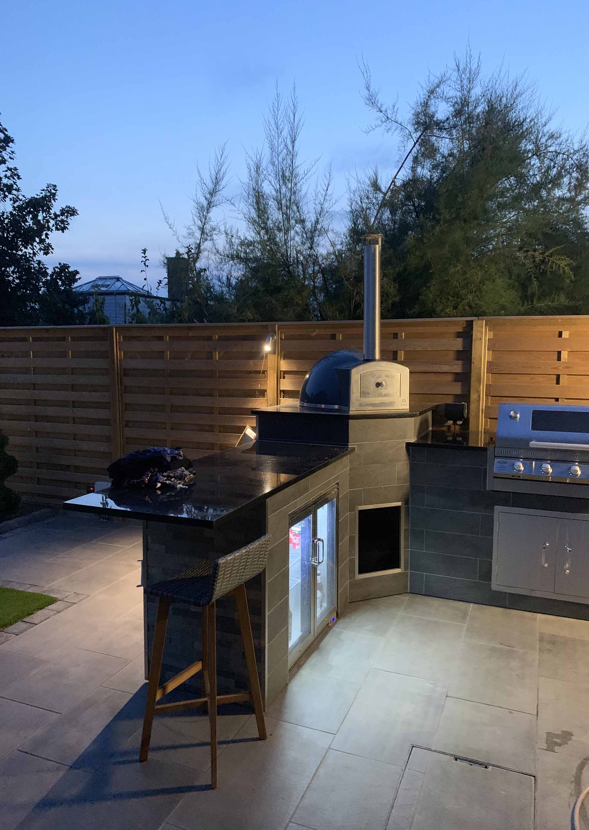 outdoor kitchen with fence panels