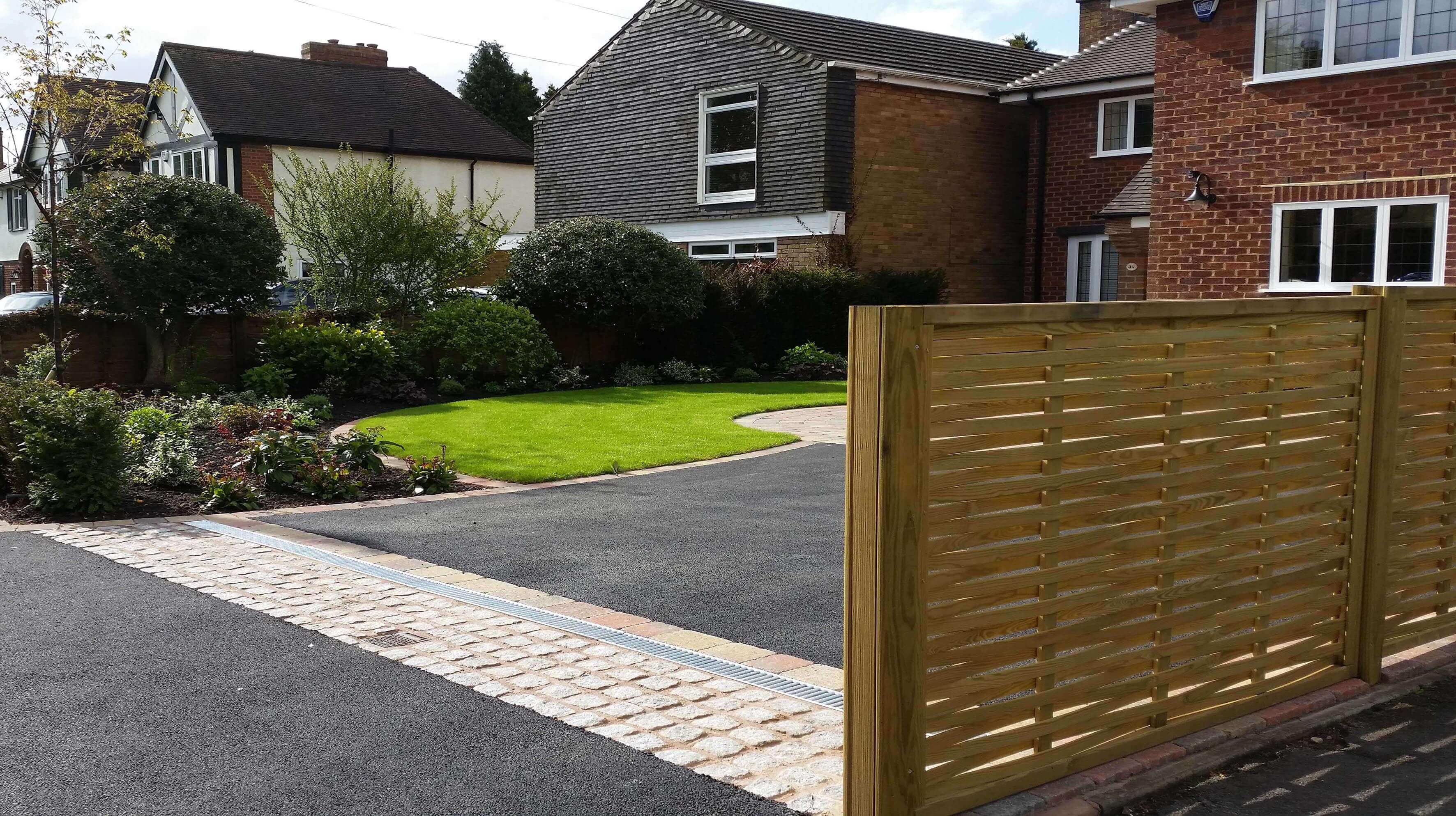 Finished driveway featuring Woven fence panels