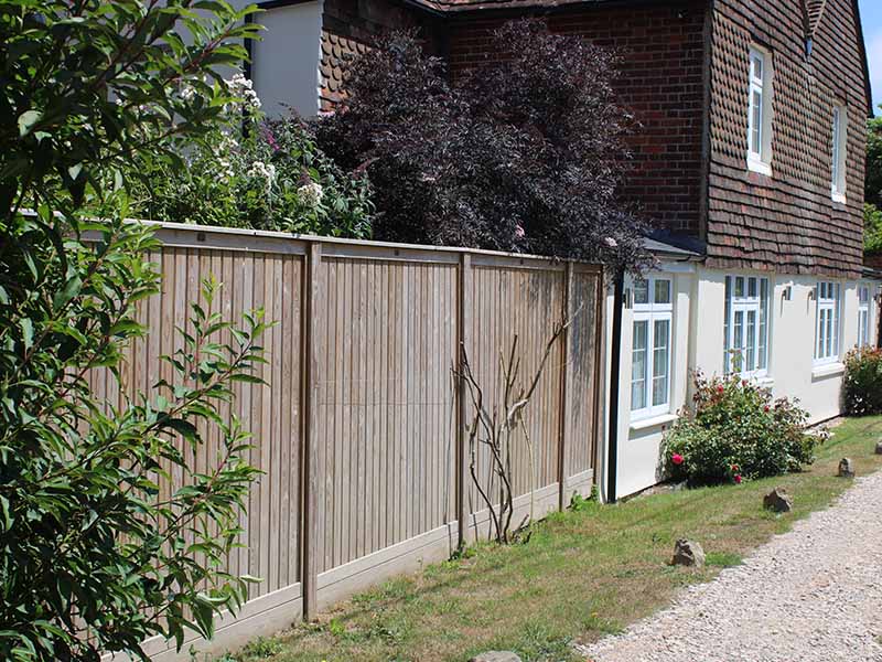 Vertical Tongue and Groove Effect fence panels in garden
