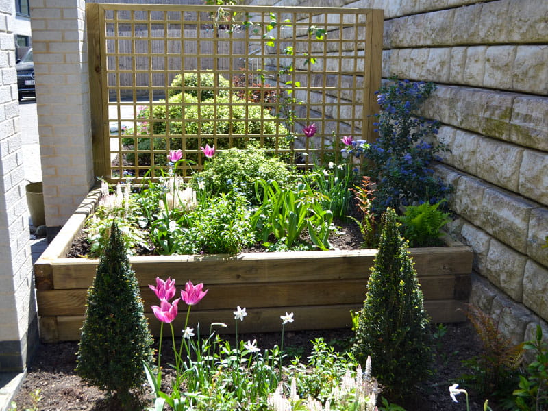Timber sleepers for flowerbed