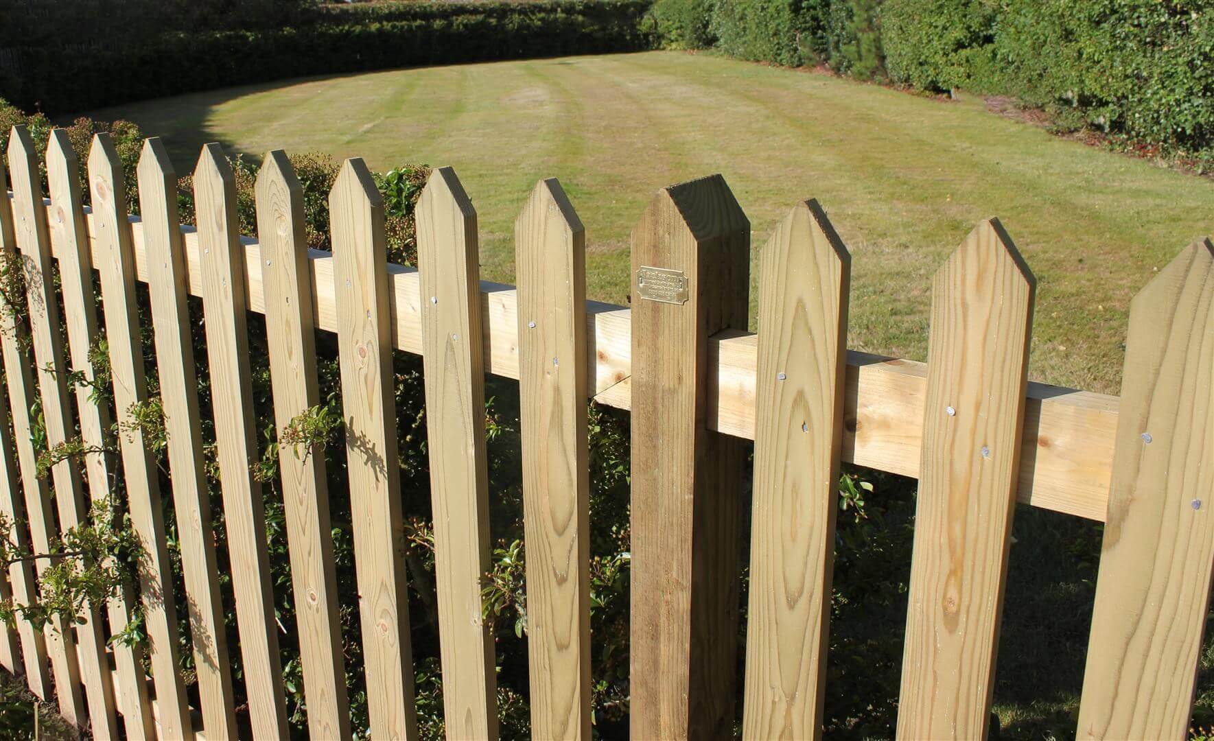 Timber palisade garden fence