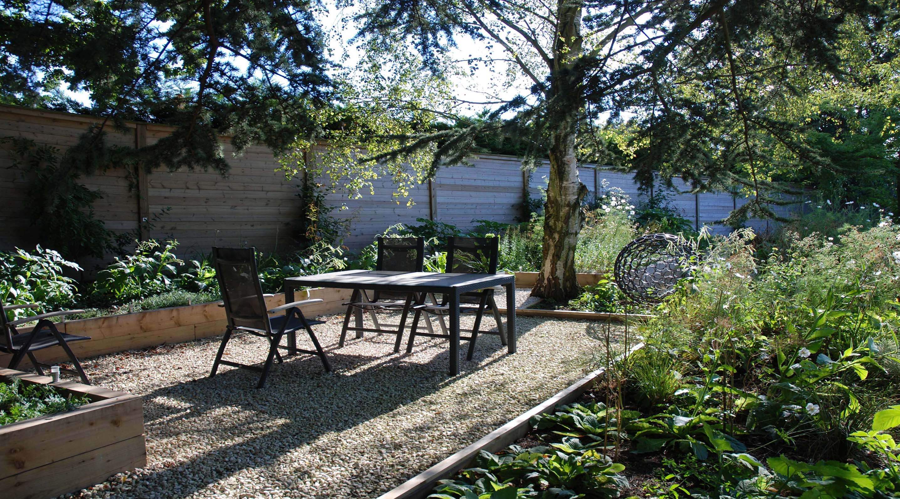 New seating area with Jakoustic fencing panel sleeper garden design