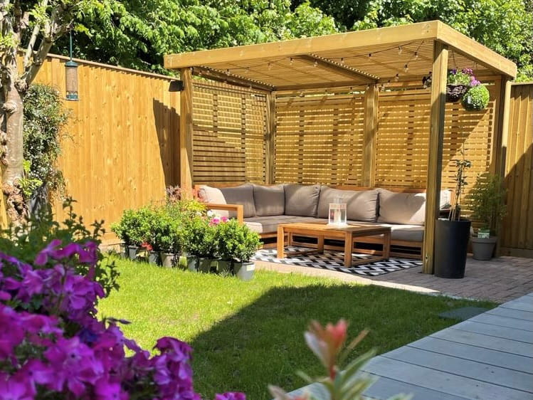 Outdoor retreat shelter with corner sofa
