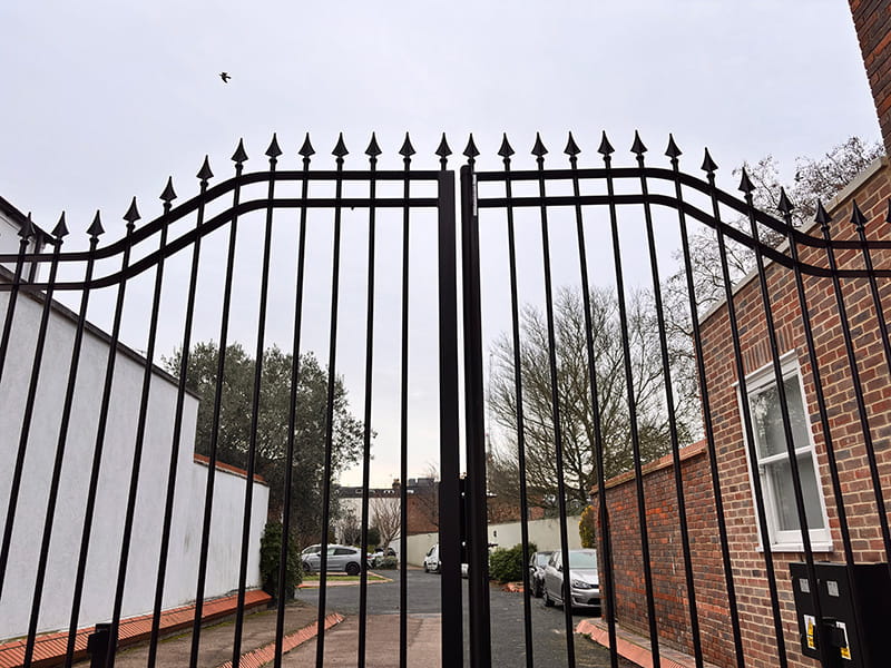 Arched top metal driveway gate