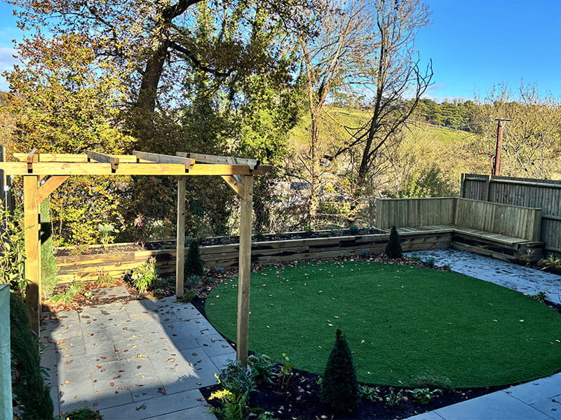 Modern Garden Design with a Wooden Pergola and Timber Sleepers