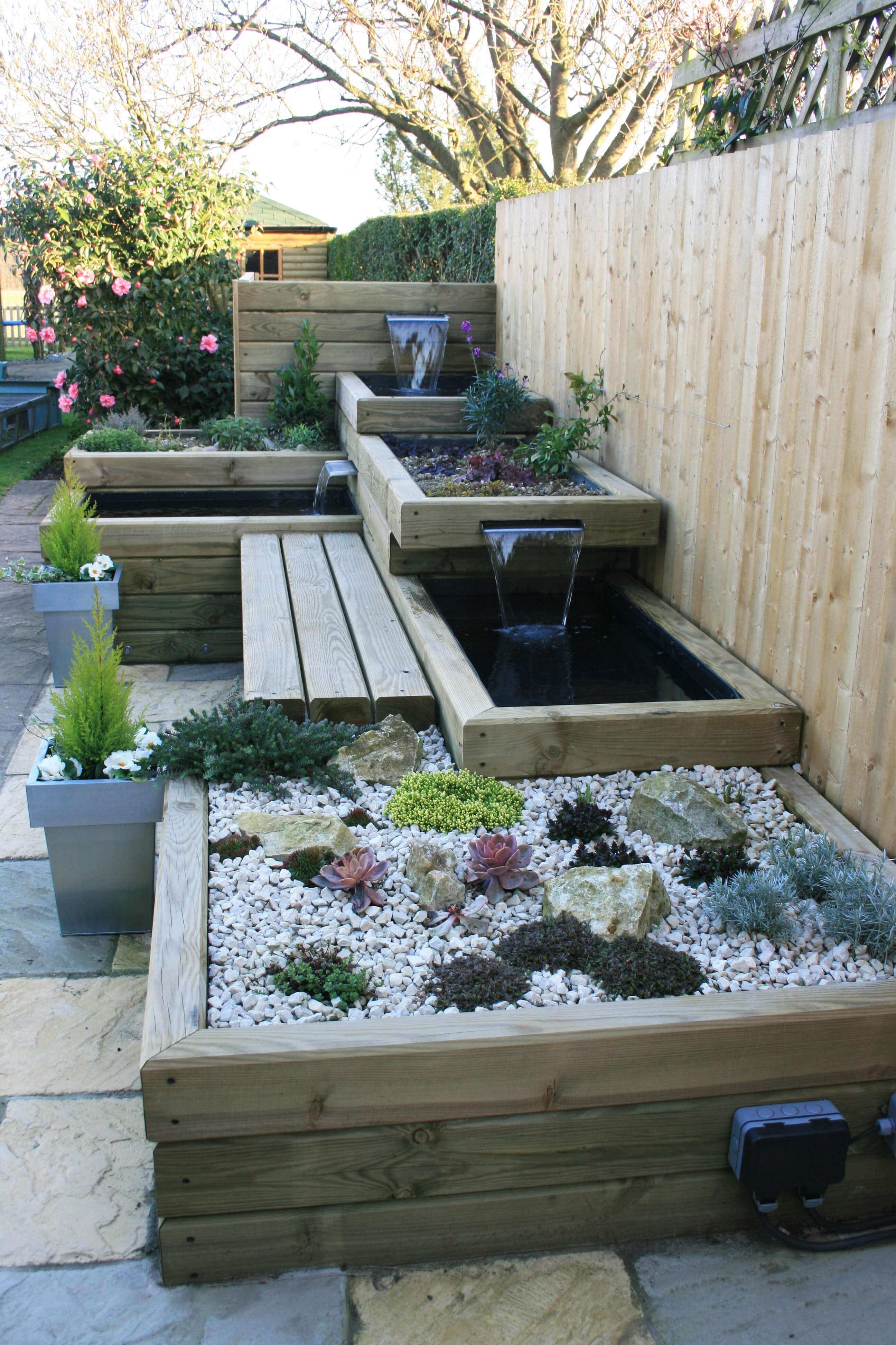 garden with water features bench fencing panel garden design