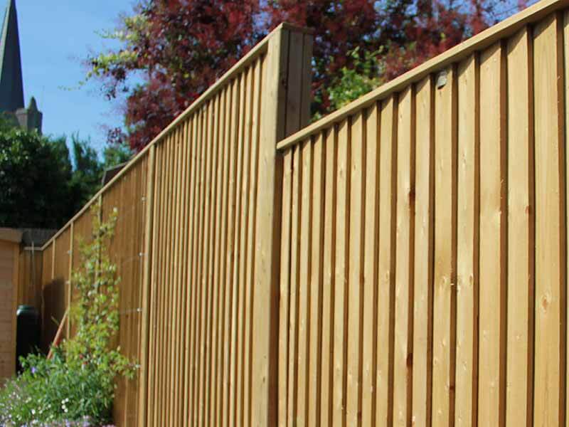 How to Build a Horizontal Plank Fence in a Hillside Backyard