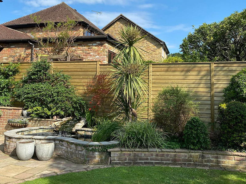 Slatted privacy fence panel