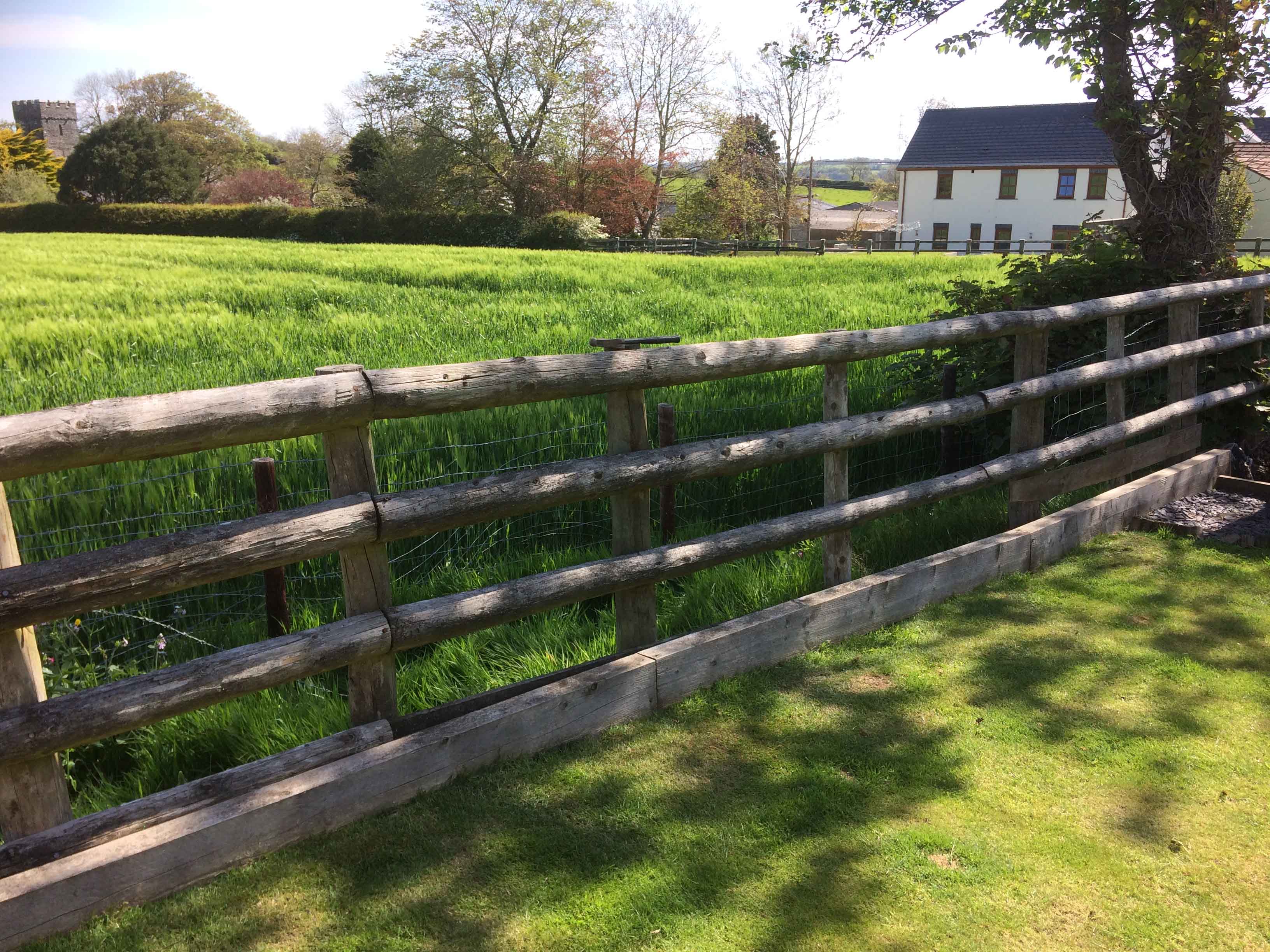 Wind resistant fencing protects rural family garden Jacksons Fencing