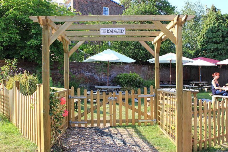 Create inviting entrances to gardens with a pergola