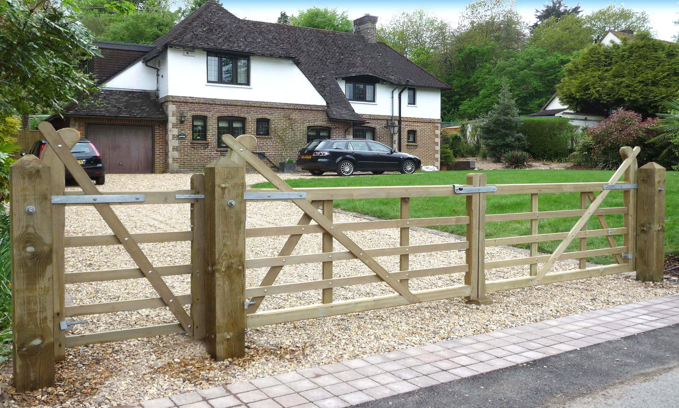 Timber entrance gates on driveway