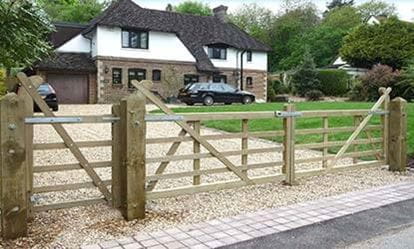 Timber entrance gates on driveway