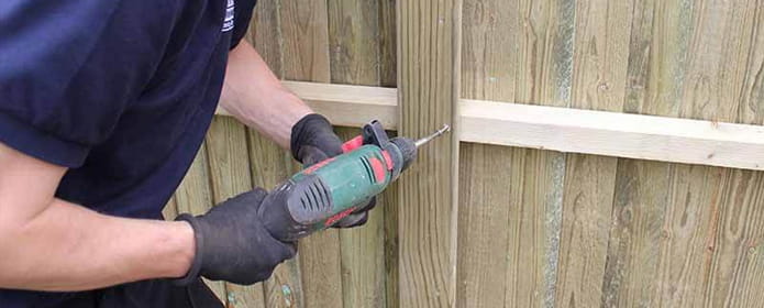 screwing-fence-panel