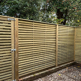 Modern slatted privacy fencing