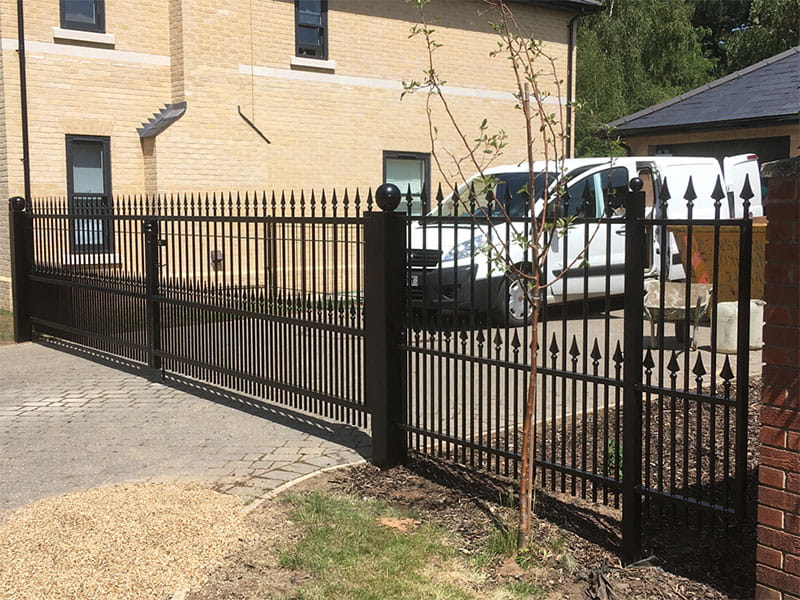 1.5m high black ornamental metal railings and gate