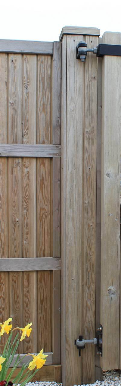 Courtyard gate post with timber cladding