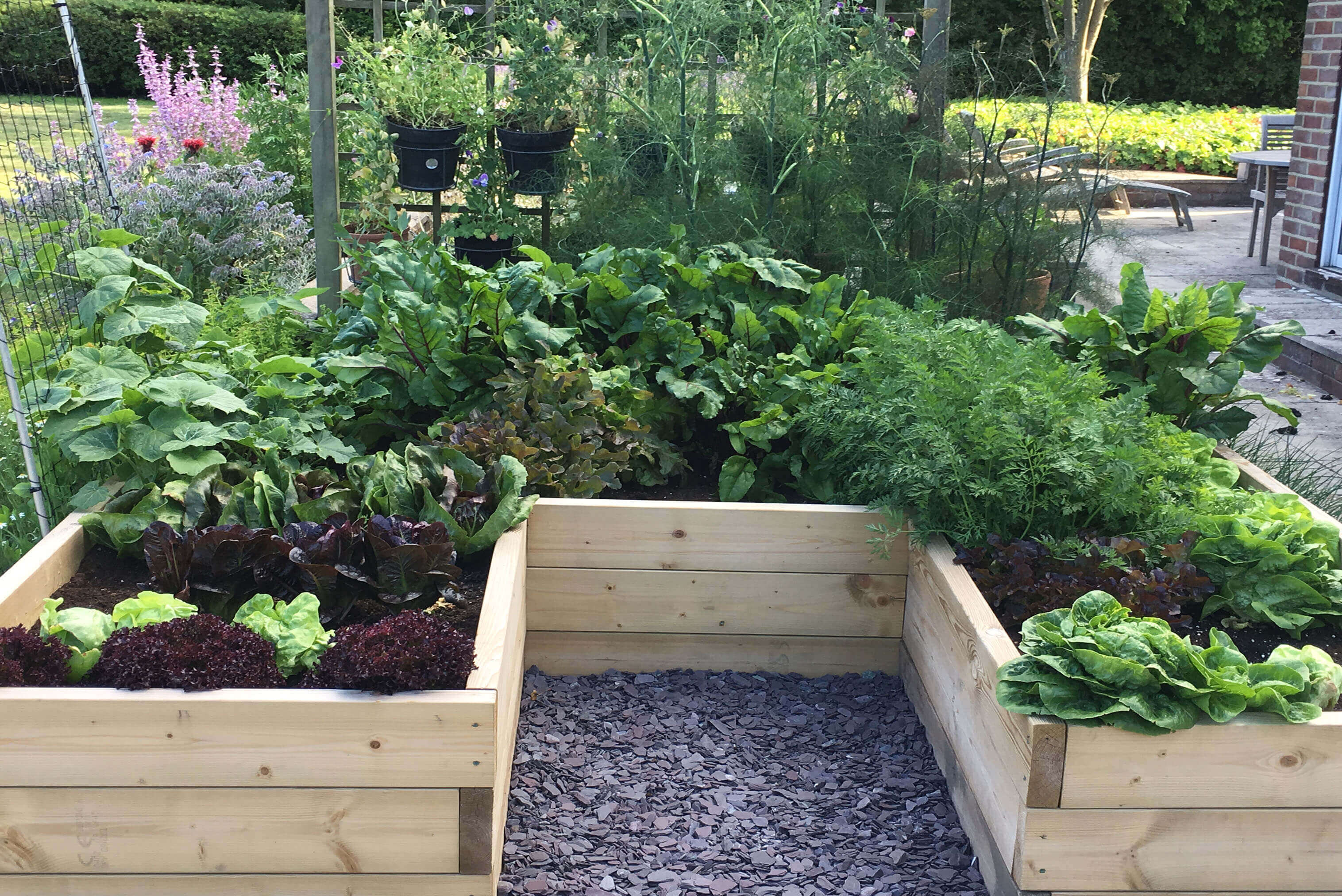 A raised flower bed made from Jacksons timber sleepers