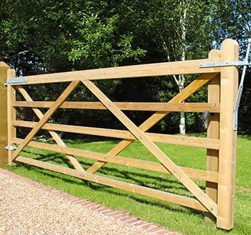 Wooden field gate over driveway